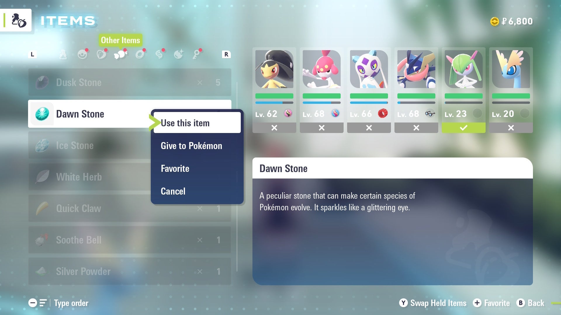 Игрок использует Dawn Stone на Kirlia из своего рюкзака в Pokémon Legends Z-A